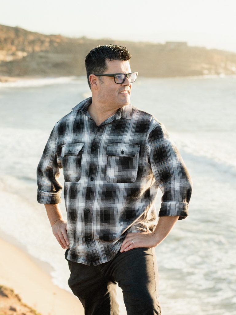 Luis Piteira Lisbon Wedding Photographer posing on beach cliffs in Ericeira Portugal