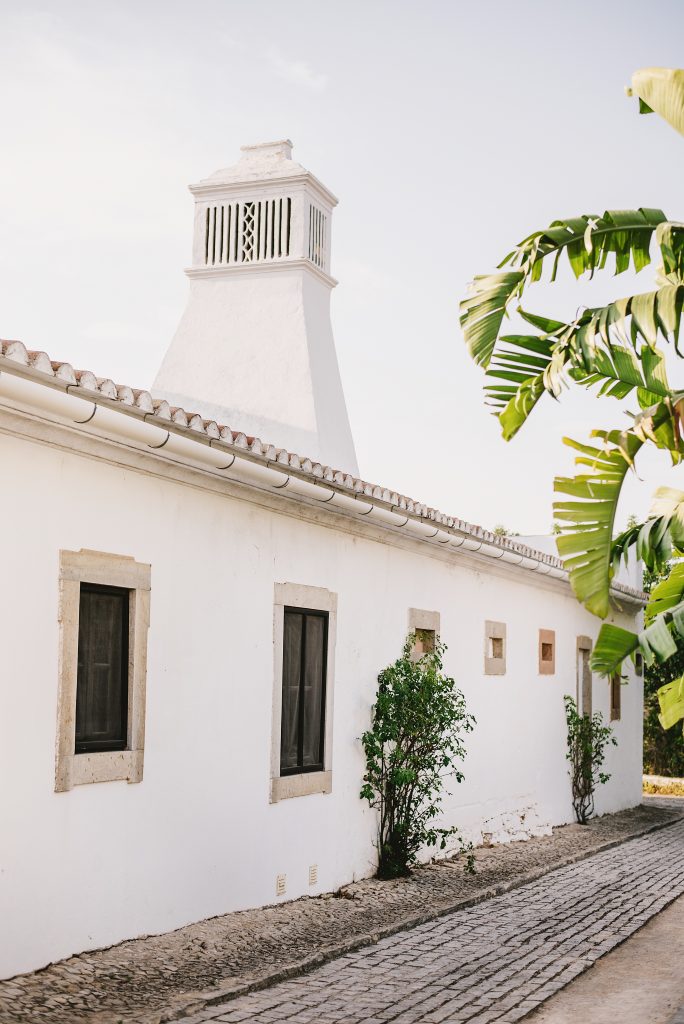 a white Palace with a bell tower in the Algarve landscape