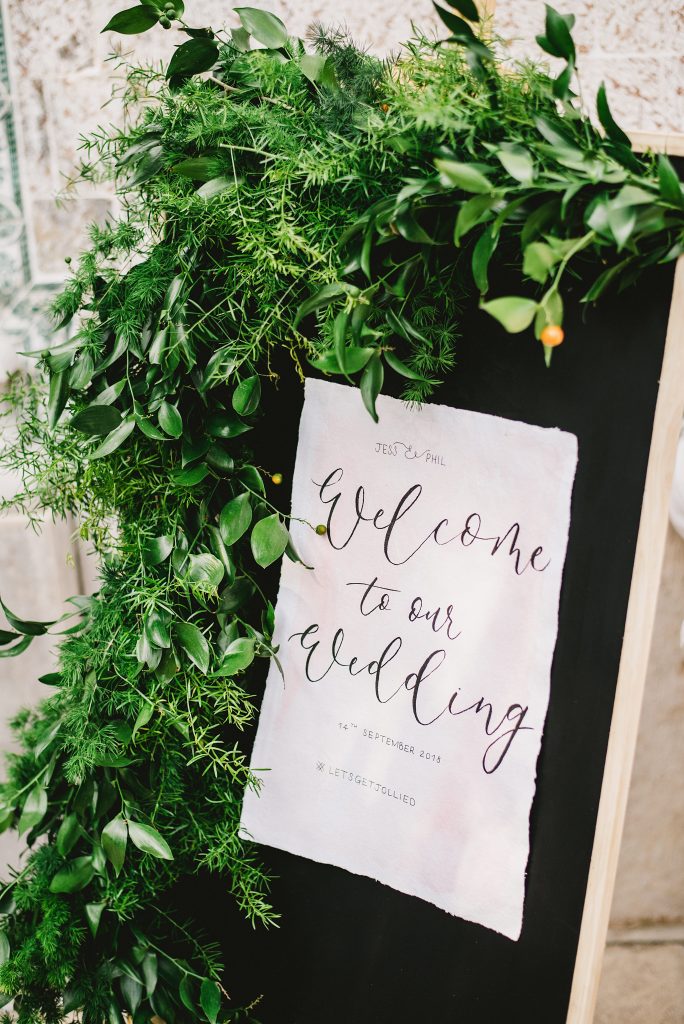 Wedding decorations with greenery around it